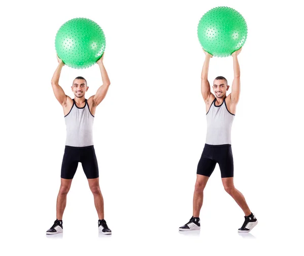 Hombre con pelota suiza haciendo ejercicios en blanco — Foto de Stock