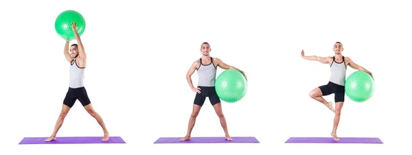 Homem com bola suíça fazendo exercícios em branco — Fotografia de Stock