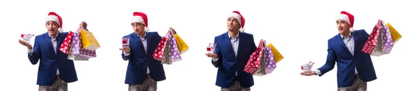 Junger Mann mit Taschen nach dem Weihnachtseinkauf auf weißem Hintergrund — Stockfoto