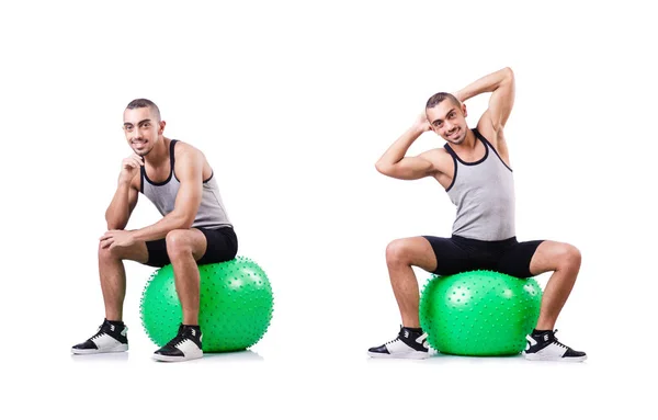 Hombre con pelota suiza haciendo ejercicios en blanco —  Fotos de Stock