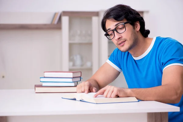 Young handsome student studying at home — Stock Photo, Image