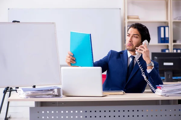 Young handsome businessman working in the office — Stock Photo, Image