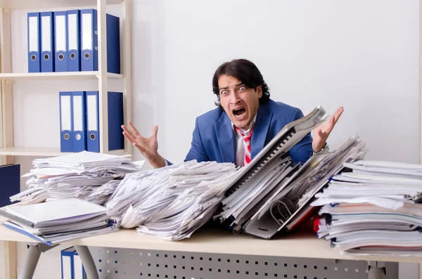 Young businessman employee unhappy with excessive work — Stock Photo, Image