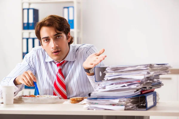 Man having meal at work during break