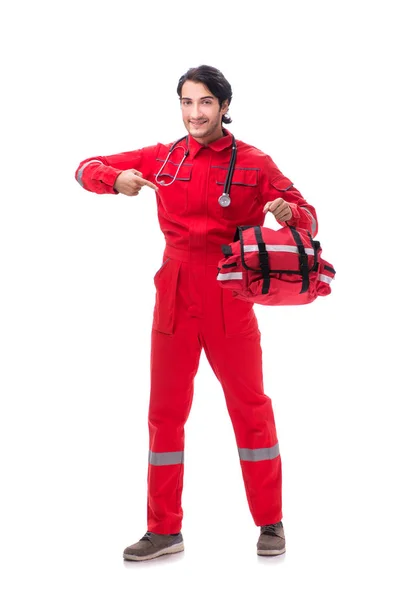 Giovane paramedico in uniforme rossa isolato su bianco — Foto Stock