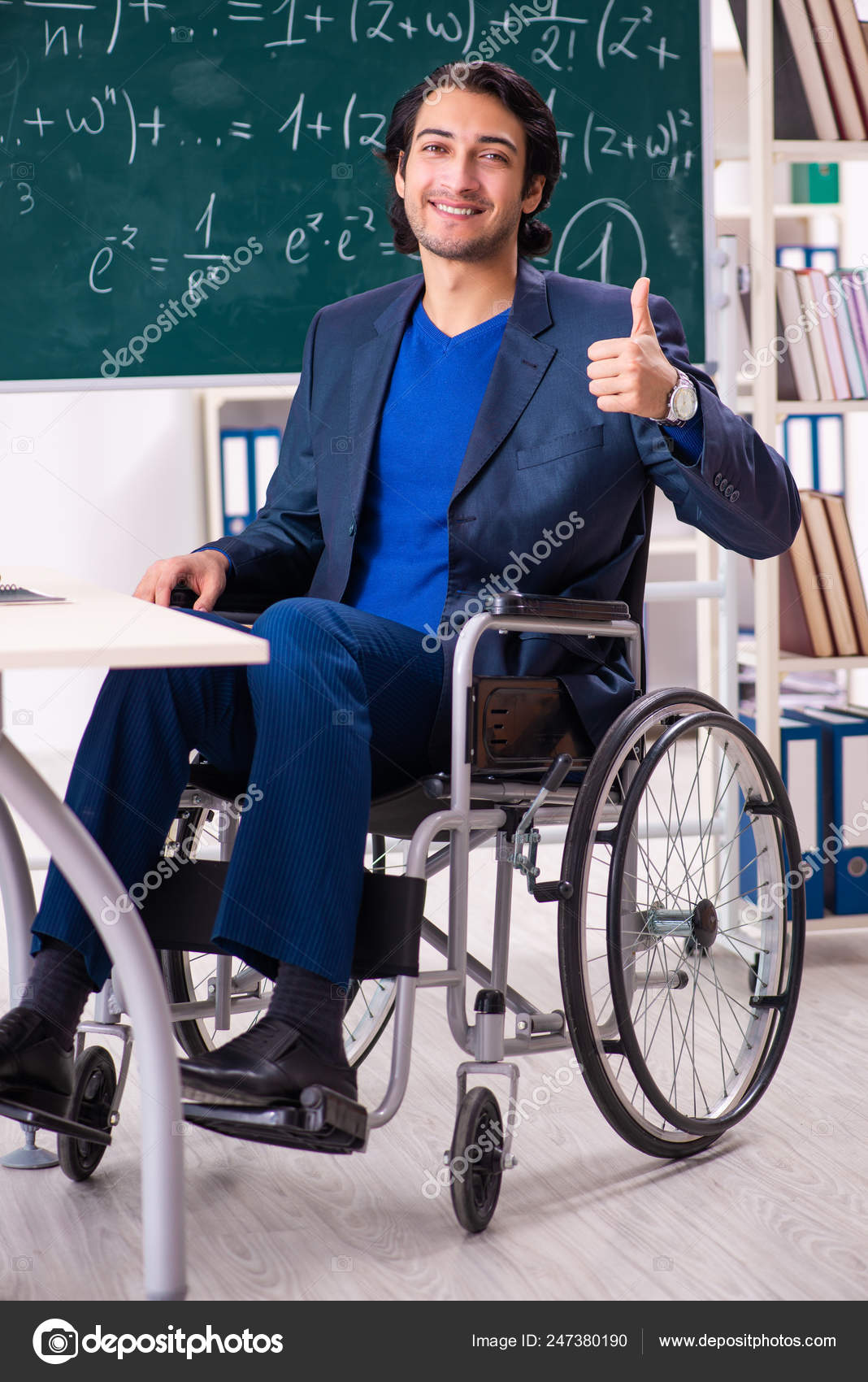 Young Handsome Man In Wheelchair In Front Of Chalkboard Stock