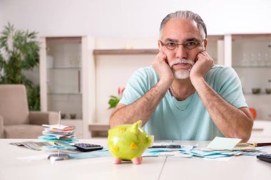 White bearded old man in budget planning concept  clipart