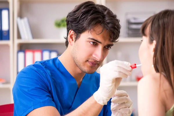Doctor getting saliva test sample in clinic hospital — Stock Photo, Image