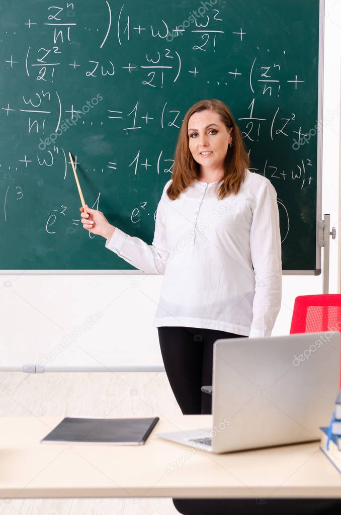 Female math teacher in the classroom 