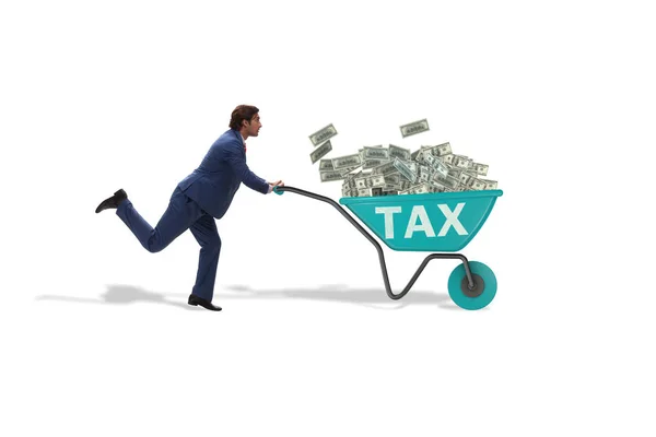 Empresário empurrando carrinho de mão cheio de dinheiro em conceito fiscal — Fotografia de Stock