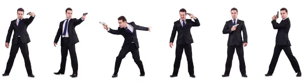 Hombre de traje con pistola aislada en blanco —  Fotos de Stock