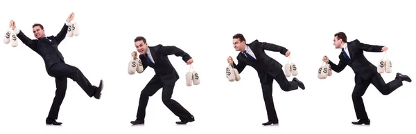 Empresário com sacos de dinheiro isolados em branco — Fotografia de Stock