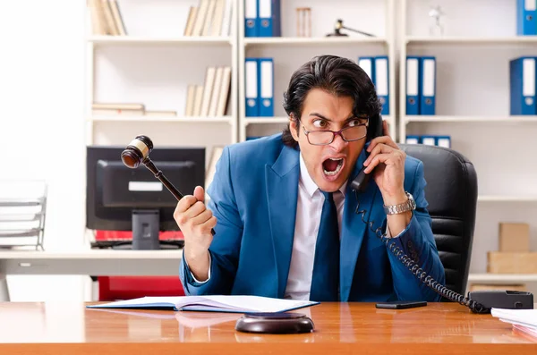 Young handsome judge sitting in courtroom — Stock Photo, Image