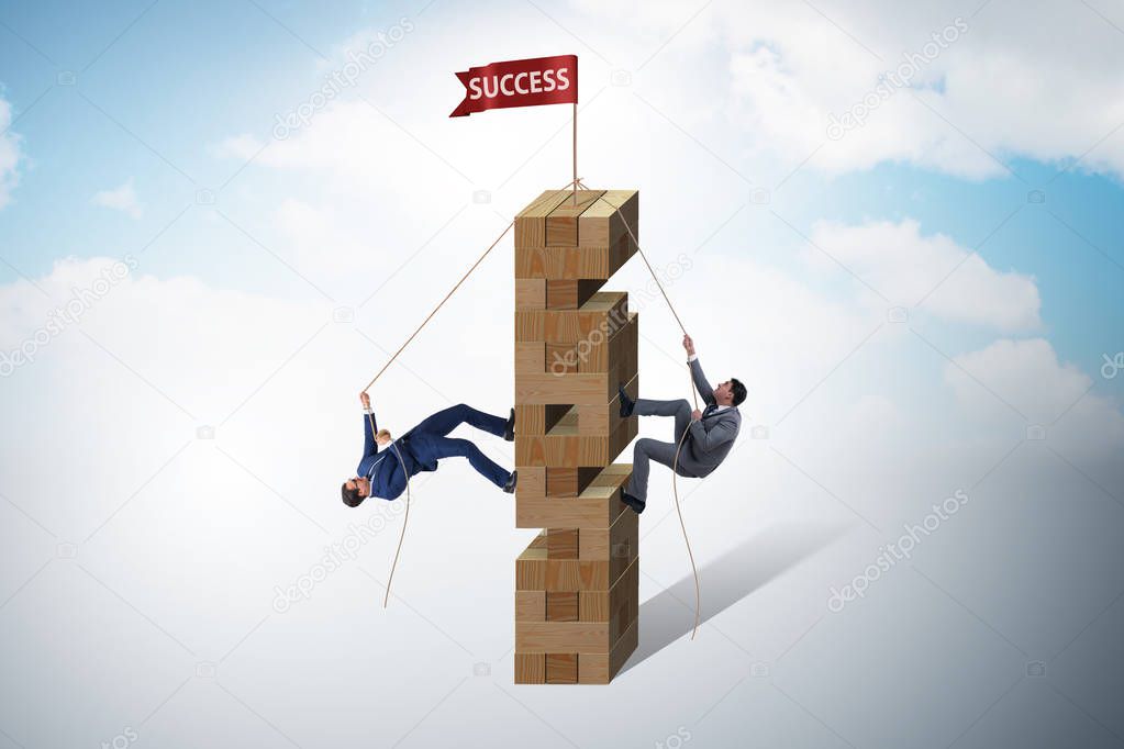 Competition concept with two businessmen climbing tower