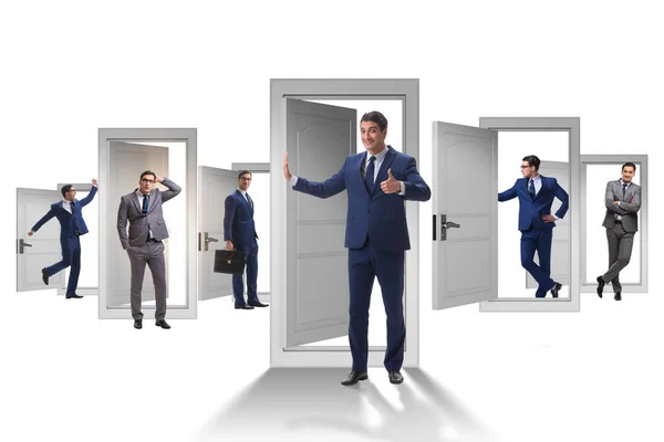 Businessman in uncertainty concept with many doors — Stock Photo, Image