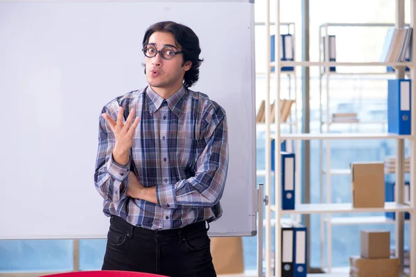 Funny male teacher in front of whiteboard — Stock Photo, Image