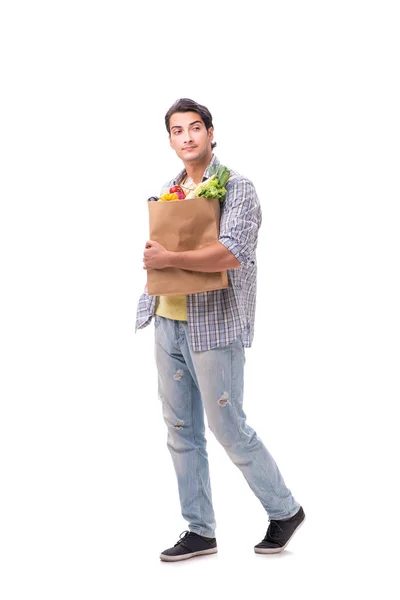 Joven con su tienda de comestibles en blanco —  Fotos de Stock