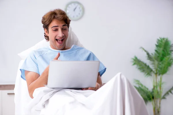 Young male patient lying on couch in hospital