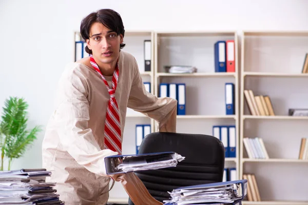Crazy young man in straitjacket at the office — Stock Photo, Image