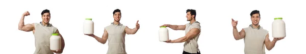 Homem muscular com frascos de proteína no branco — Fotografia de Stock