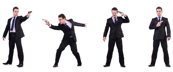 Homme en costume avec pistolet isolé sur blanc — Photo