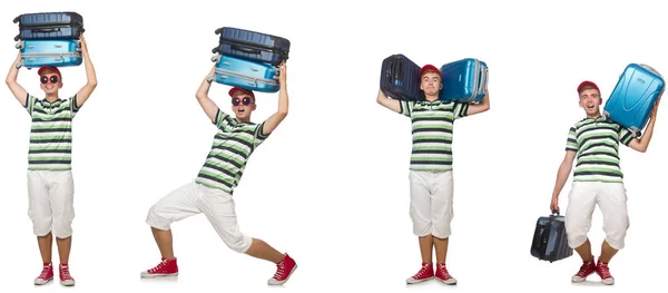 Młody człowiek z ciężkimi walizkami na białym tle — Zdjęcie stockowe