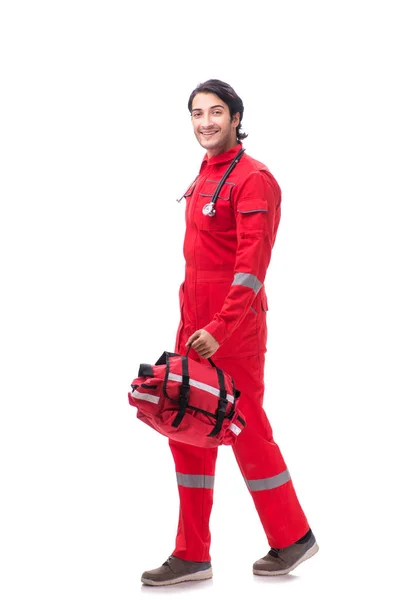 Young paramedic in red uniform isolated on white — Stock Photo, Image