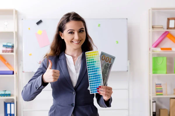 Young female designer working in the office — Stock Photo, Image