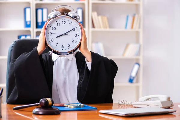 Middle-aged female doctor working in courthouse