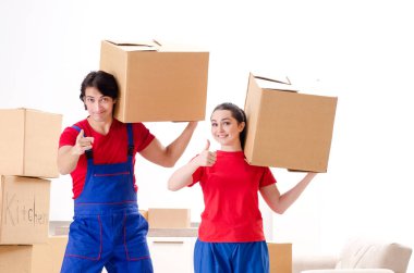Professional movers doing home relocation  clipart