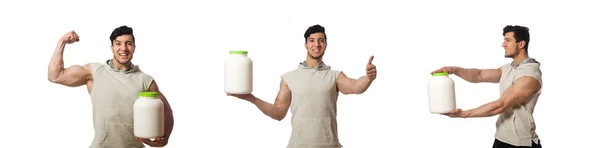 Homem muscular com frascos de proteína no branco — Fotografia de Stock