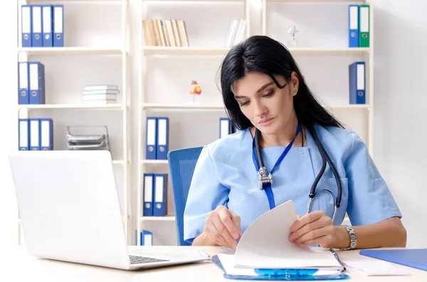 Middle aged female doctor working at the clinic — Stock Photo, Image
