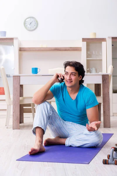 Young handsome man doing morning exercises — Stock Photo, Image