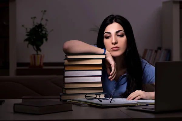 Young female student preparing for exams at night time — Stock Photo, Image