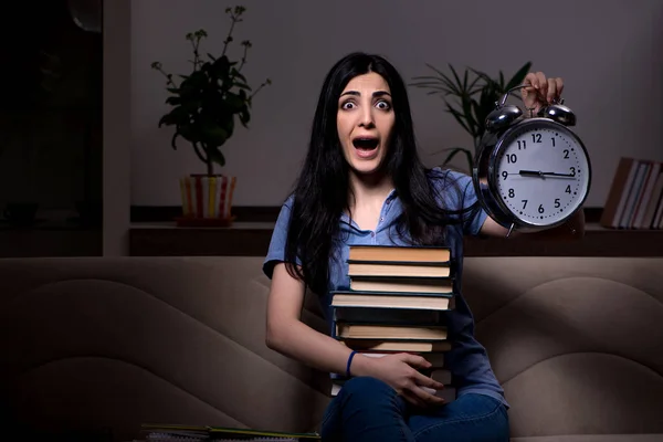 Young female student preparing for exams at night time — Stock Photo, Image