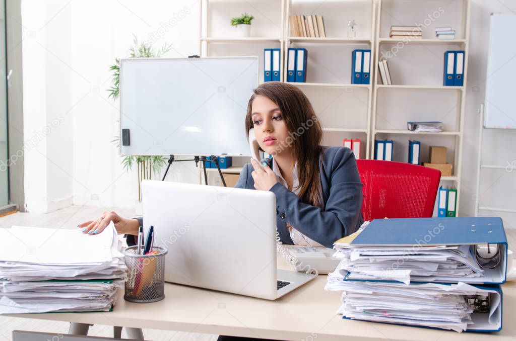 Beautiful female employee unhappy with excessive work 