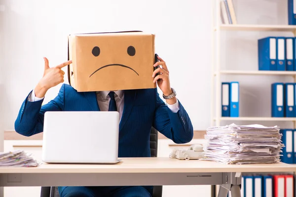 Unhappy man employee with box instead of his head — Stock Photo, Image