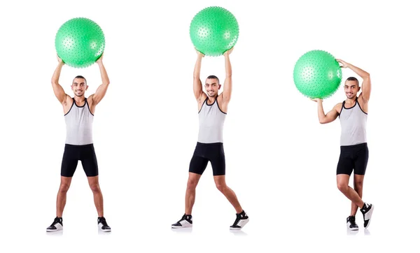 Homem com bola suíça fazendo exercícios em branco — Fotografia de Stock