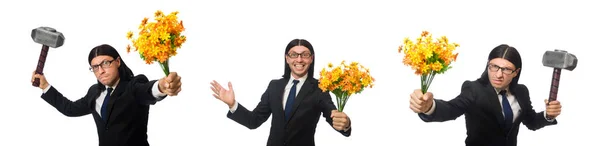 Man in pak met hamer en bloemen — Stockfoto