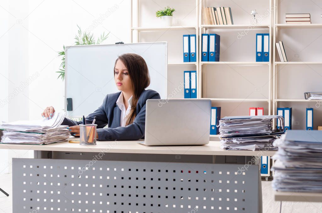 Beautiful female employee unhappy with excessive work