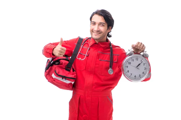 Jeune ambulancier en uniforme rouge isolé sur blanc — Photo