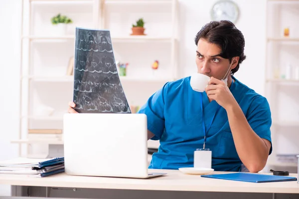 Young handsome doctor radiologist working in the clinic — Stock Photo, Image