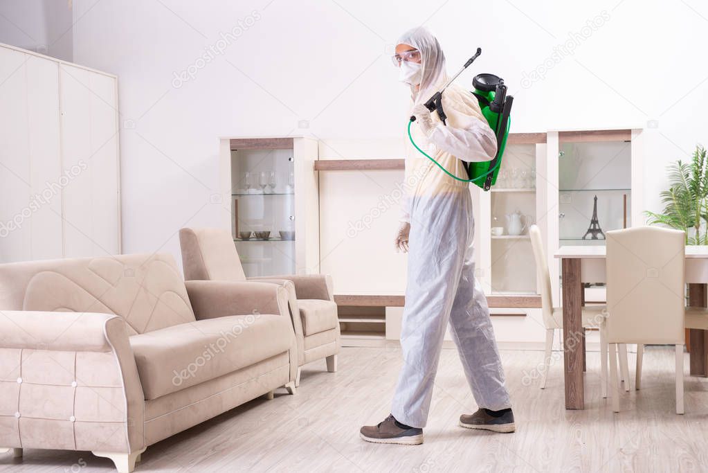 Pest control contractor working in the flat