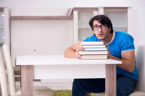 Young handsome student studying at home — Stock Photo, Image