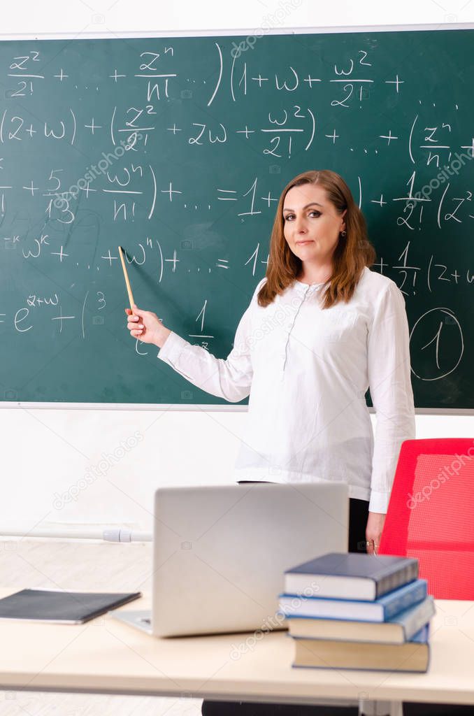 Female math teacher in the classroom