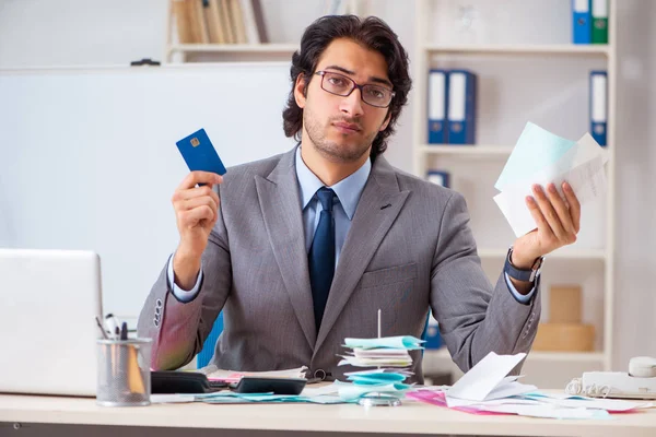 Young handsome businessman in budget planning concept — Stock Photo, Image