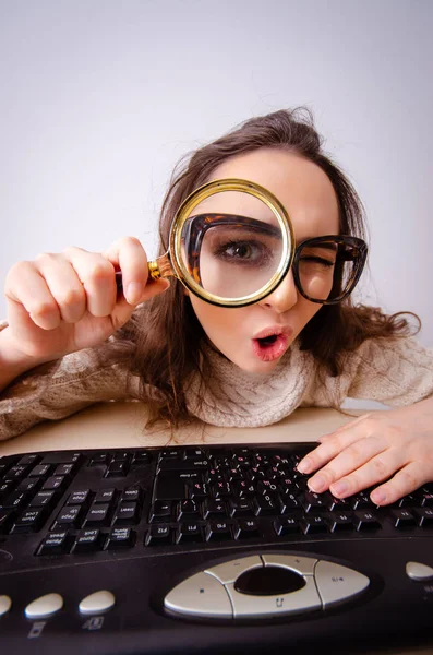 Funny nerd girl working on computer Royalty Free Stock Photos
