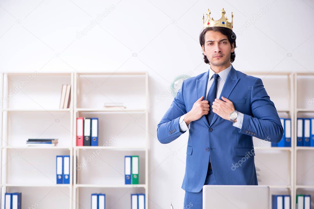 Young king businessman working in the office 