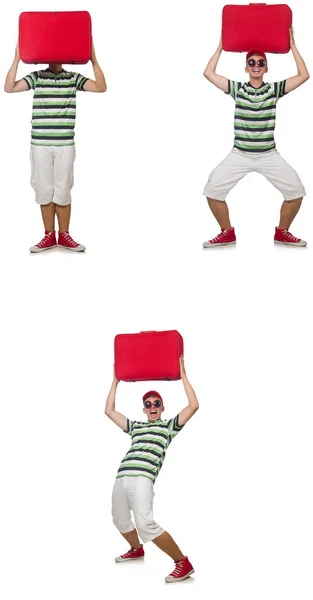 Молодой человек с красным чемоданом изолирован на белом — стоковое фото