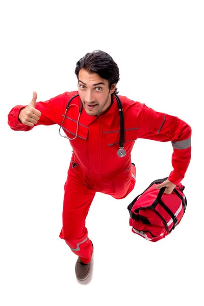 Joven paramédico en uniforme rojo aislado en blanco — Foto de Stock